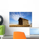 A Wooden Shed Stands Alone In A Snow Covered Field Wall Mural