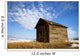 A Wooden Shed Stands Alone In A Snow Covered Field Wall Mural