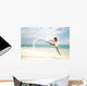 Beautiful Female Ballet Dancer Leaping Into Air Wall Mural