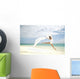 Beautiful Female Ballet Dancer Leaping Into Air Wall Mural