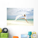 Beautiful Female Ballet Dancer Leaping Into Air Wall Mural
