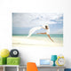 Beautiful Female Ballet Dancer Leaping Into Air Wall Mural