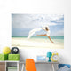 Beautiful Female Ballet Dancer Leaping Into Air Wall Mural