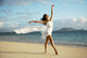 Beautiful Female Ballet Dancer On Beach Wearing White Flowing Fabric Wall Mural