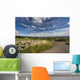 A Country Road With A Hilly Landscape Wall Mural