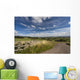 A Country Road With A Hilly Landscape Wall Mural
