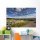 A Country Road With A Hilly Landscape Wall Mural