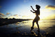 Hawaii, Female Hula Dancer On Beach, Silhouetted By Sunset Wall Mural