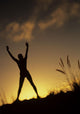 Hawaii, Silhouette Of A Woman Stretching On A Mountain Top At Sunset Wall Mural