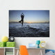 Fit Young Girl On The Beach Doing Yoga On The Rocky Coastline Wall Mural