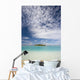 Turquoise Water And Blue Skies Surround Isolated Isalnd Wall Mural