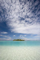 Turquoise Water And Blue Skies Surround Isolated Isalnd Wall Mural