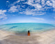 Hawaii, Woman Laying On The Beach In Remote Tropical Location Wall Mural