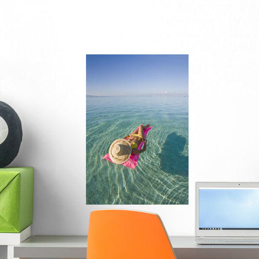 French Polynesia, Tahiti, Moorea, Woman Floating In Water Wall Mural