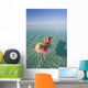 French Polynesia, Tahiti, Moorea, Woman Floating In Water Wall Mural