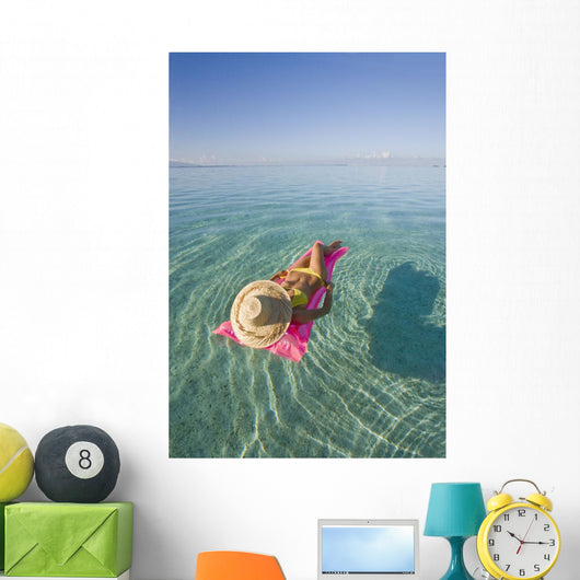 French Polynesia, Tahiti, Moorea, Woman Floating In Water Wall Mural