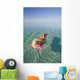 French Polynesia, Tahiti, Moorea, Woman Floating In Water Wall Mural