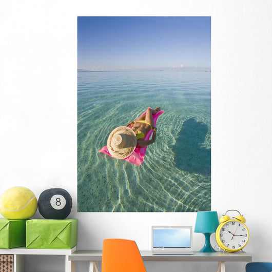 French Polynesia, Tahiti, Moorea, Woman Floating In Water Wall Mural