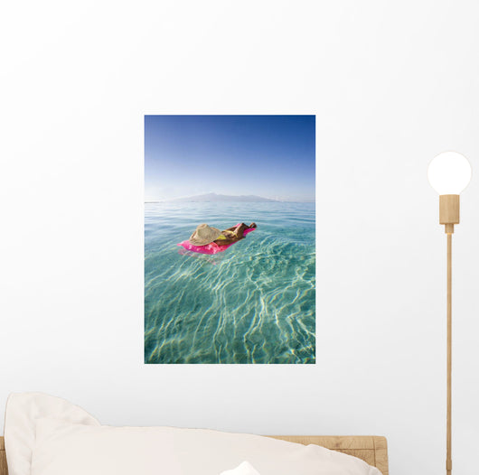 French Polynesia, Tahiti, Moorea, Woman Floating In Water Wall Mural