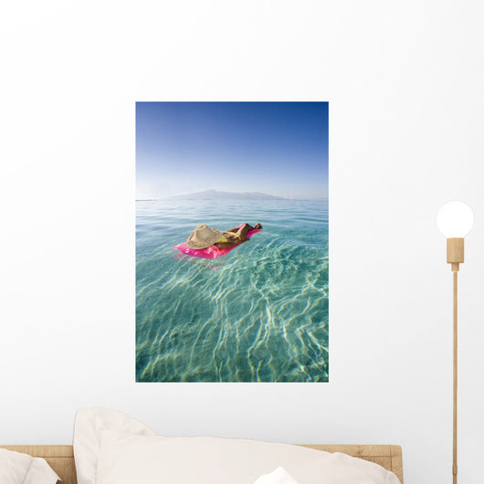 French Polynesia, Tahiti, Moorea, Woman Floating In Water Wall Mural