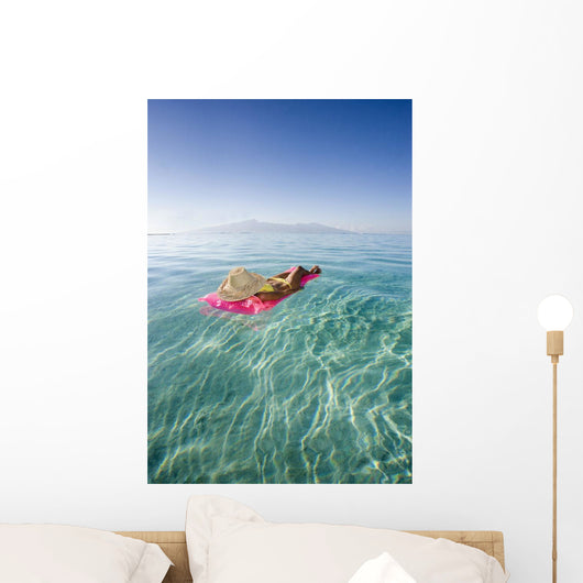 French Polynesia, Tahiti, Moorea, Woman Floating In Water Wall Mural