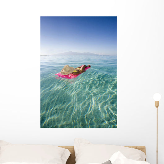 French Polynesia, Tahiti, Moorea, Woman Floating In Water Wall Mural