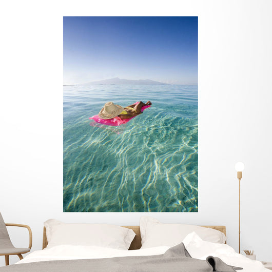French Polynesia, Tahiti, Moorea, Woman Floating In Water Wall Mural