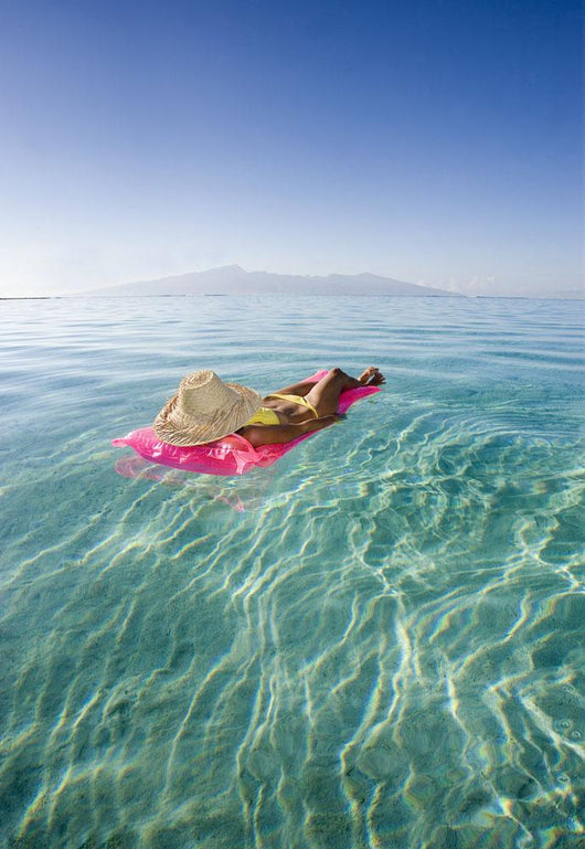 French Polynesia, Tahiti, Moorea, Woman Floating In Water Wall Mural