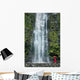 Woman Stands With Umbrella At The Base Of Waterfall Wall Mural