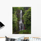 Woman Stands With Umbrella At Wailua Falls Surrounded By Foliage Wall Mural