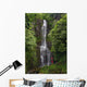 Woman Stands With Umbrella At Wailua Falls Surrounded By Foliage Wall Mural