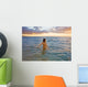 Hawaii, Kauai, Woman Walking In The Ocean As The Sun Sets Wall Mural