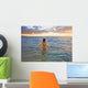 Hawaii, Kauai, Woman Walking In The Ocean As The Sun Sets Wall Mural