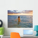 Hawaii, Kauai, Woman Walking In The Ocean As The Sun Sets Wall Mural