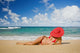 Hawaii, Woman Sitting On The Beach At A Remote Tropical Location Wall Mural