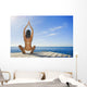 Hawaii, Woman Sitting On Dock In Remote Location Wall Mural