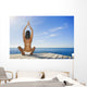 Hawaii, Woman Sitting On Dock In Remote Location Wall Mural