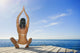 Hawaii, Woman Sitting On Dock In Remote Location Wall Mural