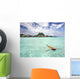 Woman Floating In Water Near Resort Wall Mural