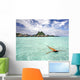Woman Floating In Water Near Resort Wall Mural