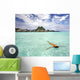 Woman Floating In Water Near Resort Wall Mural