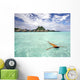 Woman Floating In Water Near Resort Wall Mural