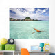 Woman Floating In Water Near Resort Wall Mural