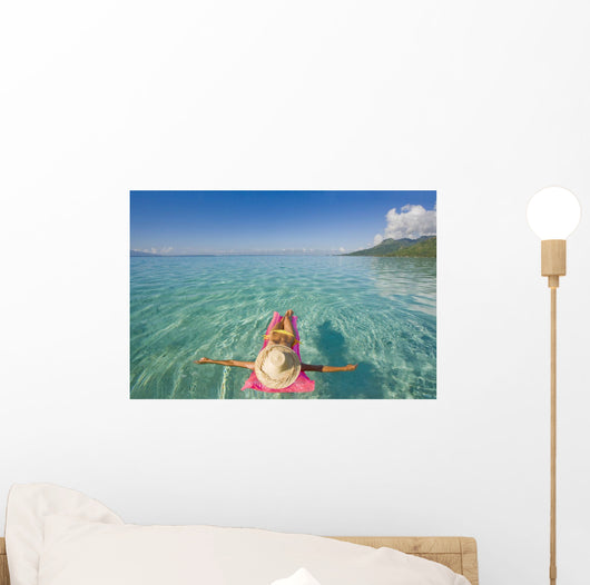French Polynesia, Tahiti, Moorea, Woman Floating In Water Wall Mural