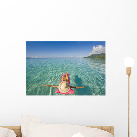 French Polynesia, Tahiti, Moorea, Woman Floating In Water Wall Mural