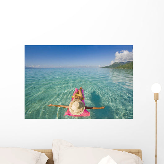 French Polynesia, Tahiti, Moorea, Woman Floating In Water Wall Mural