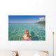 French Polynesia, Tahiti, Moorea, Woman Floating In Water Wall Mural