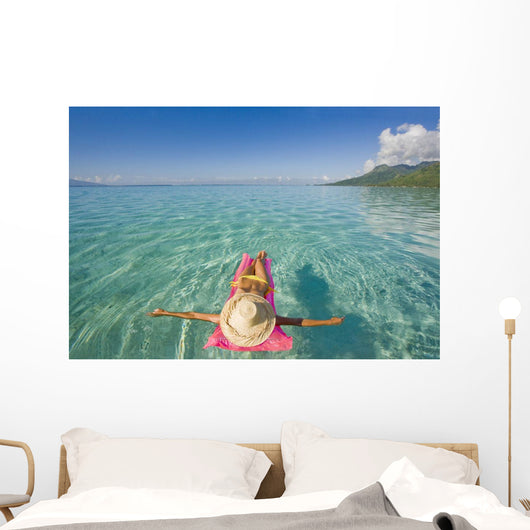 French Polynesia, Tahiti, Moorea, Woman Floating In Water Wall Mural