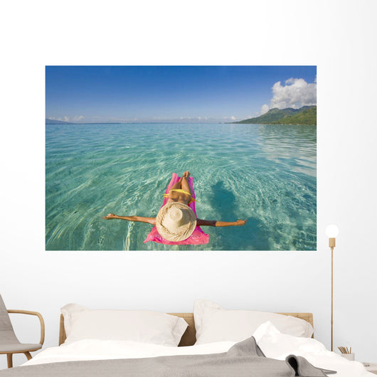 French Polynesia, Tahiti, Moorea, Woman Floating In Water Wall Mural