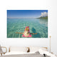 French Polynesia, Tahiti, Moorea, Woman Floating In Water Wall Mural